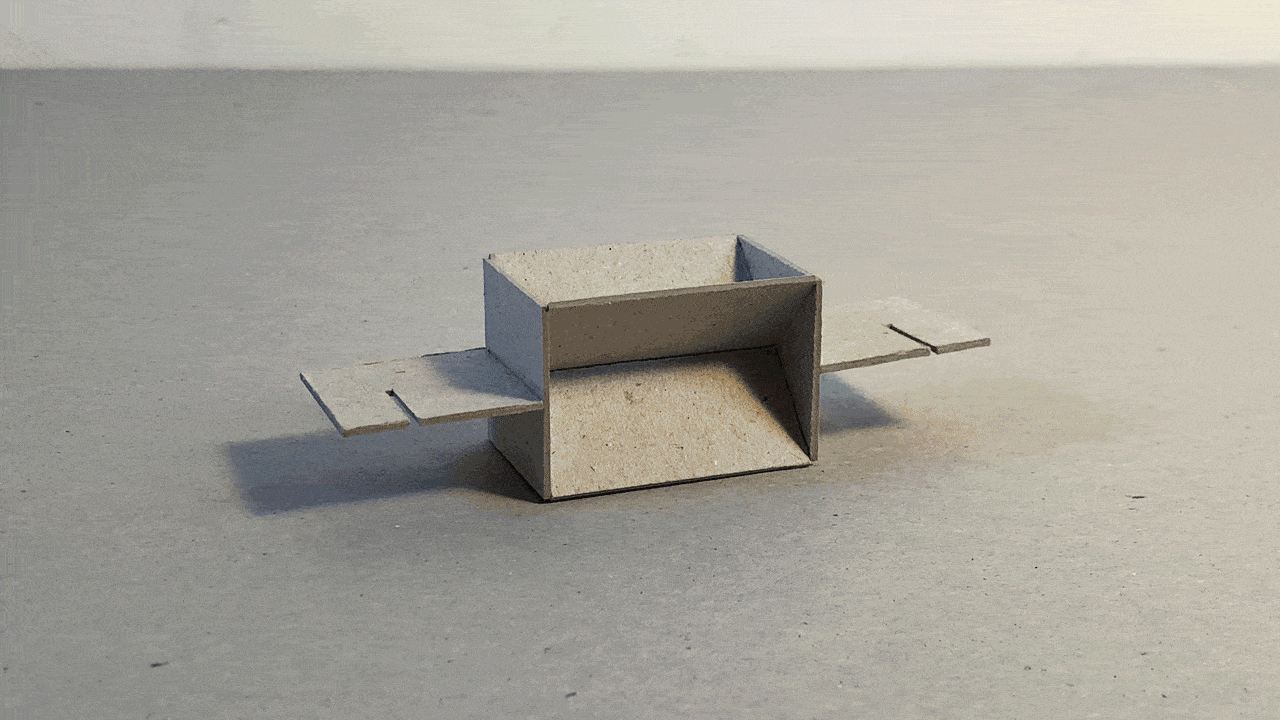 A number of distinct modular 3D cardboard structures acting as symbols