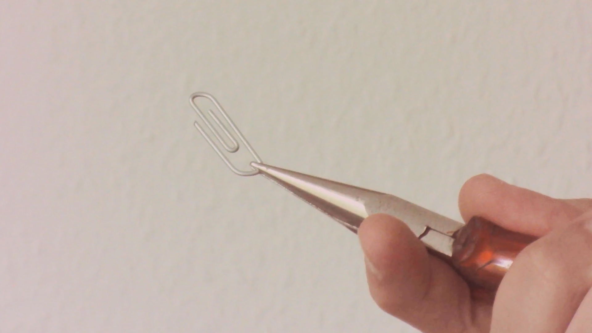 The final bend is made the the needle-nose pliers, further along for a larger bend radius