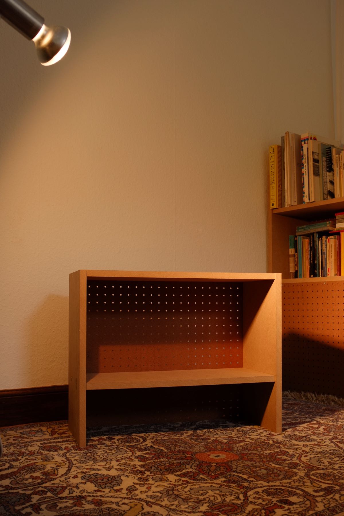 A photo of the single module from above in front of the assembled shelves